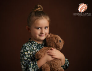 Award Winning Fine Art Photography image of a girl with a teddy bear by Family and Child Photographer in Basingstoke, Hampshire
