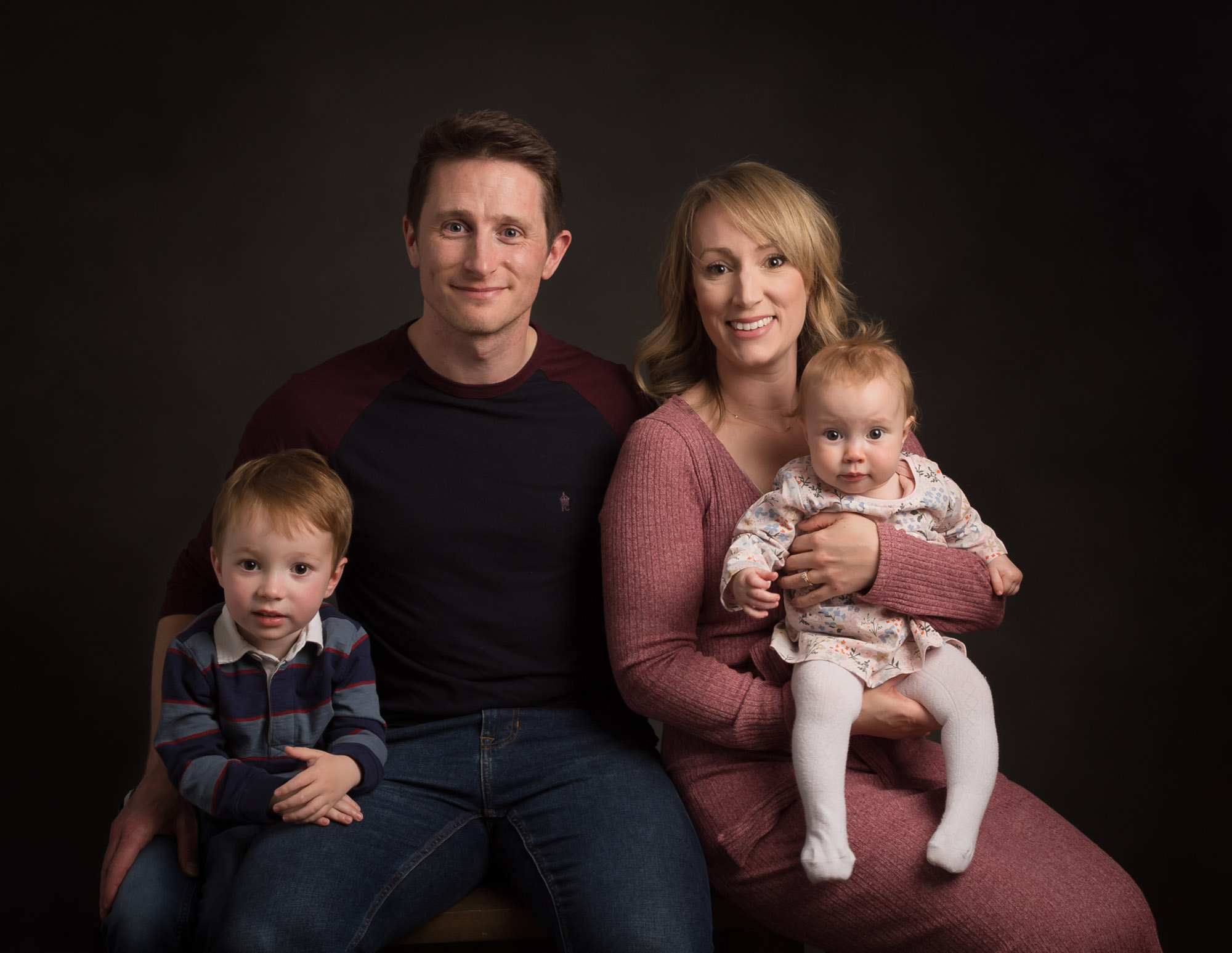family with parents, young boy and a baby girl by Family and Child Photographer in Basingstoke, Hampshire