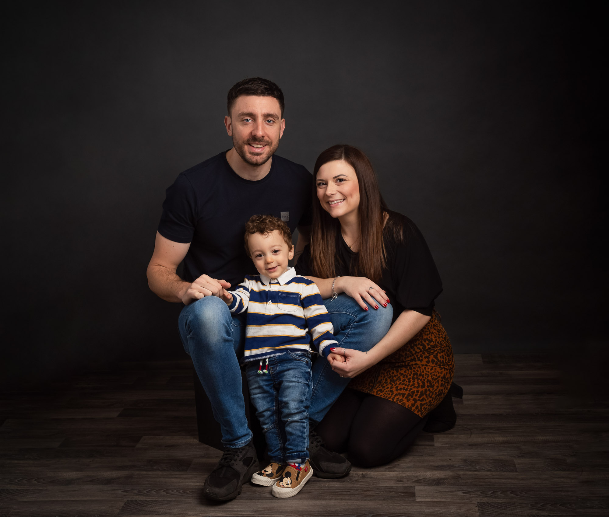 family with little boy in a photo studio by Family Photographer in Basingstoke, Hampshire