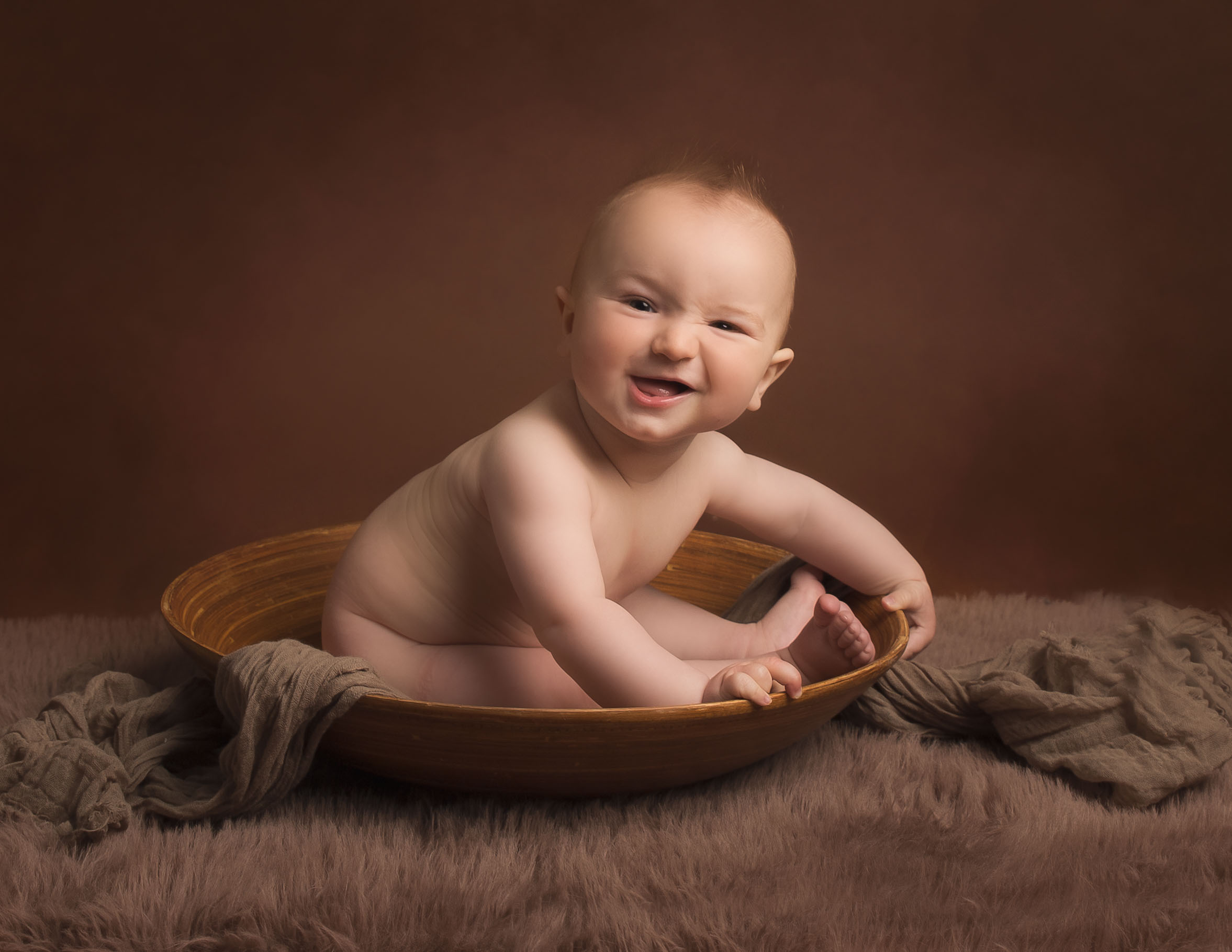 6 month old Baby Boy satin round wooden bowl smiling