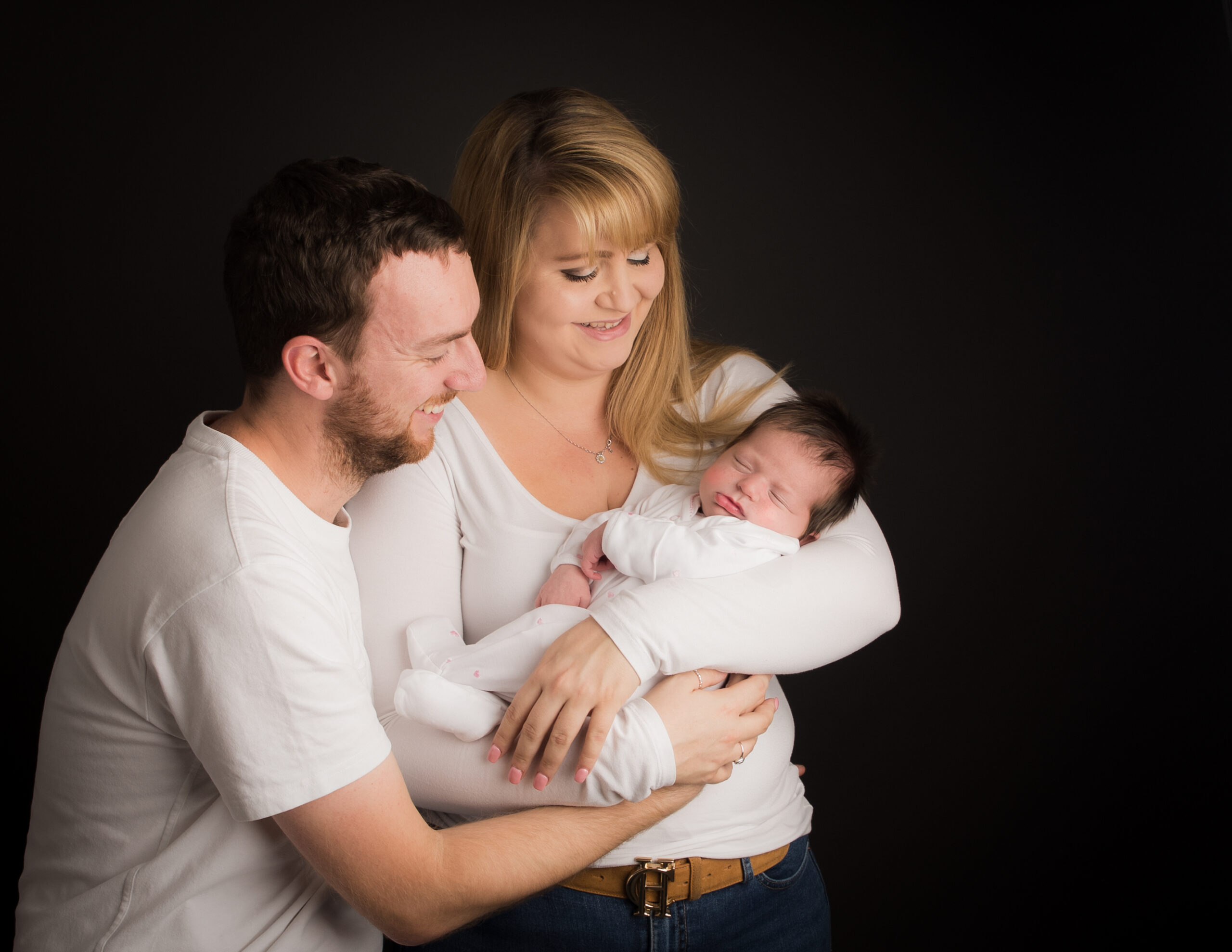 Mum, Dad and Baby Dressed in white by Newborn Photographer in Hampshire