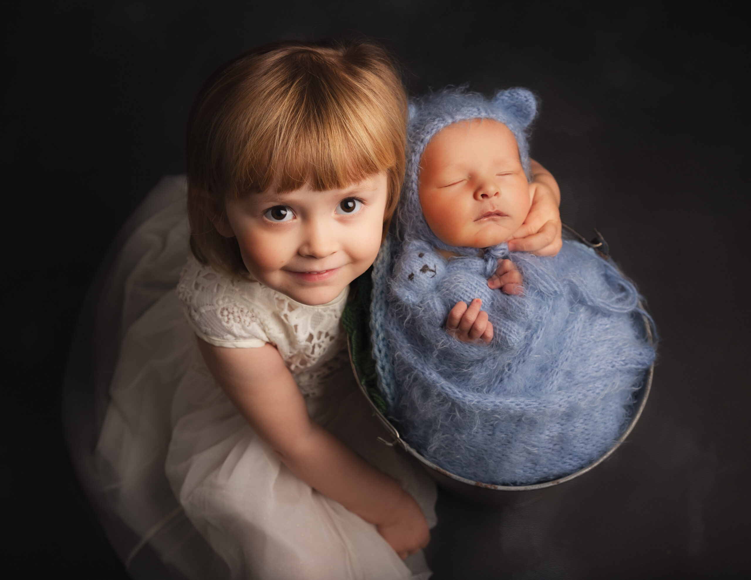 little girl holding bay brother